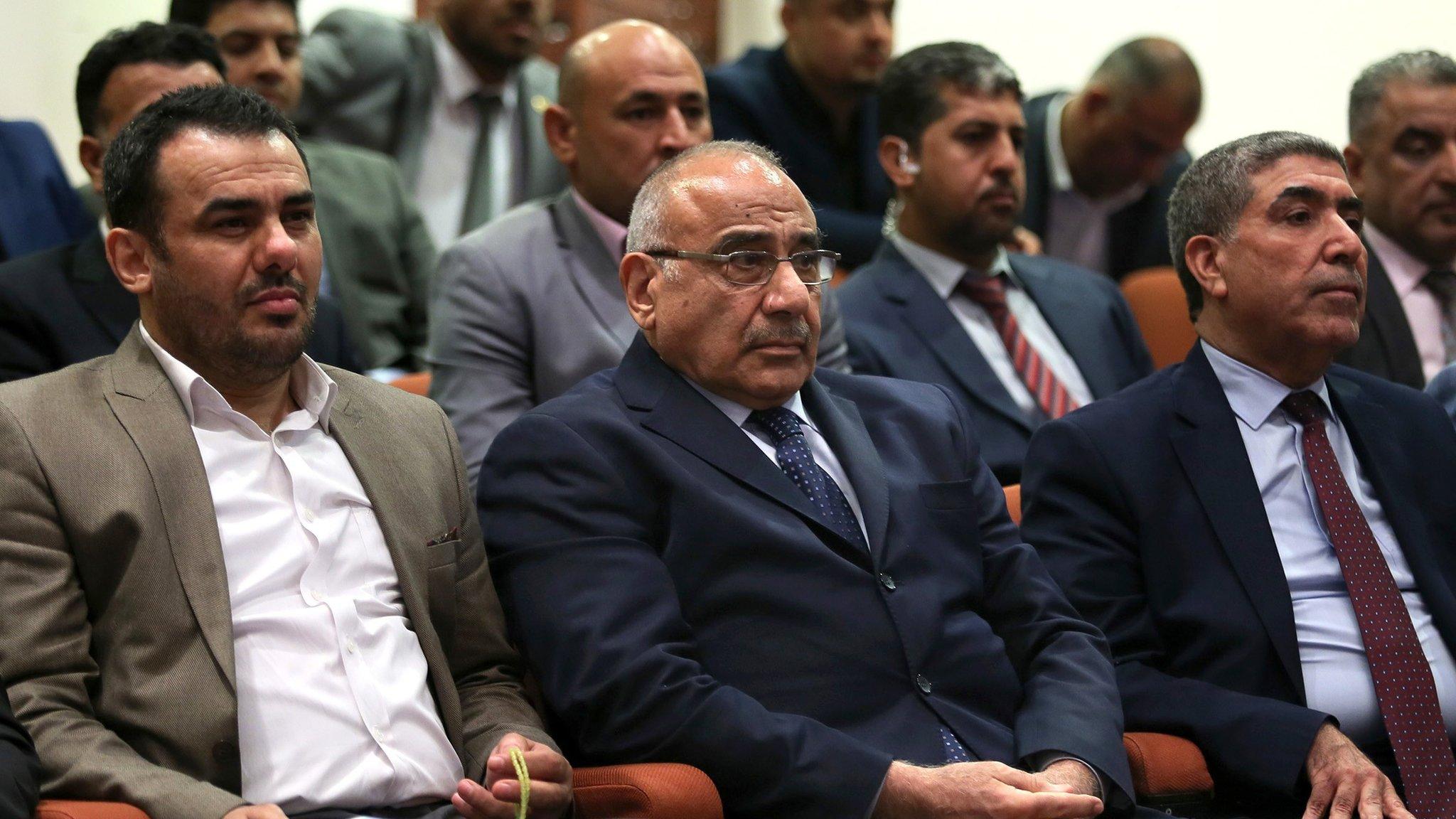 Adel Abdul Mahdi (C) sits in the Iraqi parliament in Baghdad on 2 October 2018