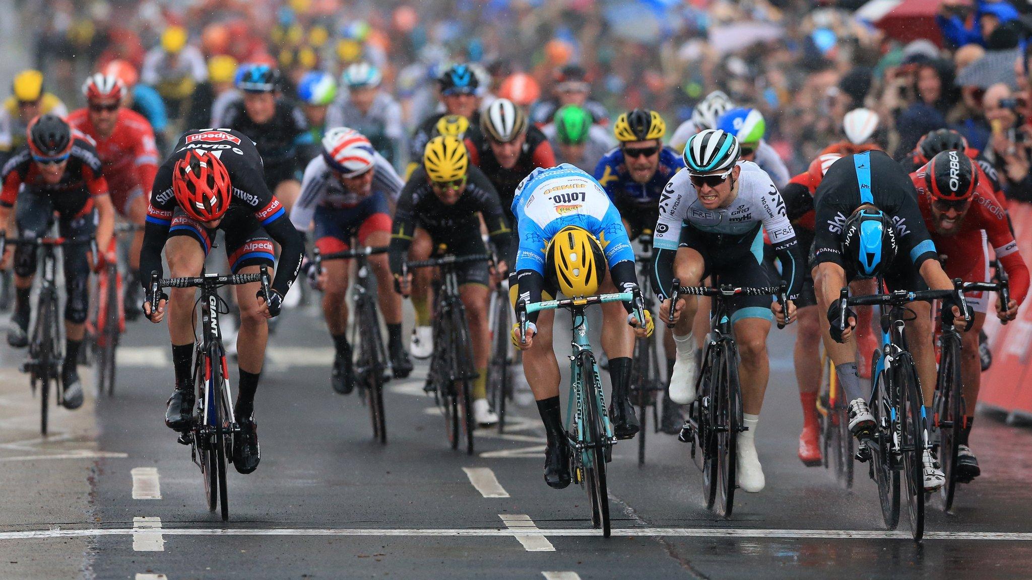 Team Sky's Danny van Poppel (second right) ducks and powers over the line.