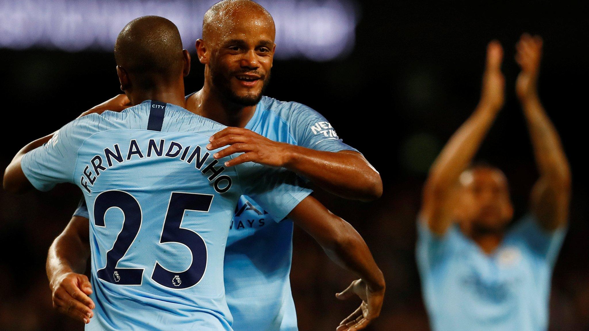 Fernandinho and Kompany hug