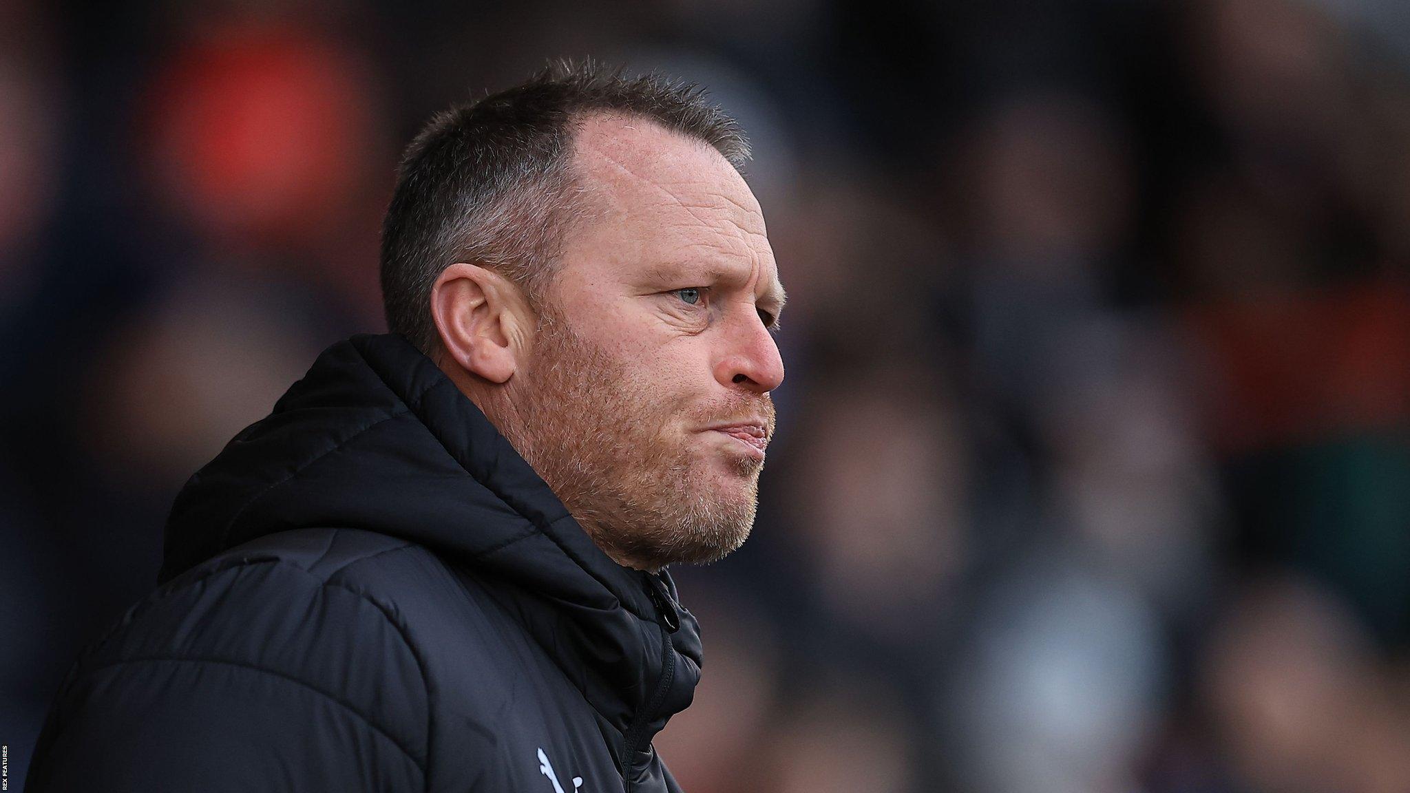 Michael Flynn looks on during their game against Crawley