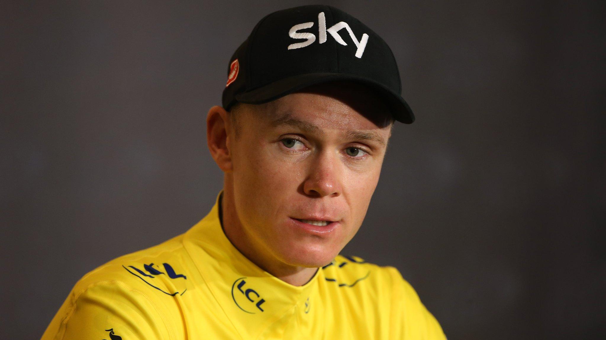 Chris Froome addresses the media while wearing the yellow jersey at the Tour de France