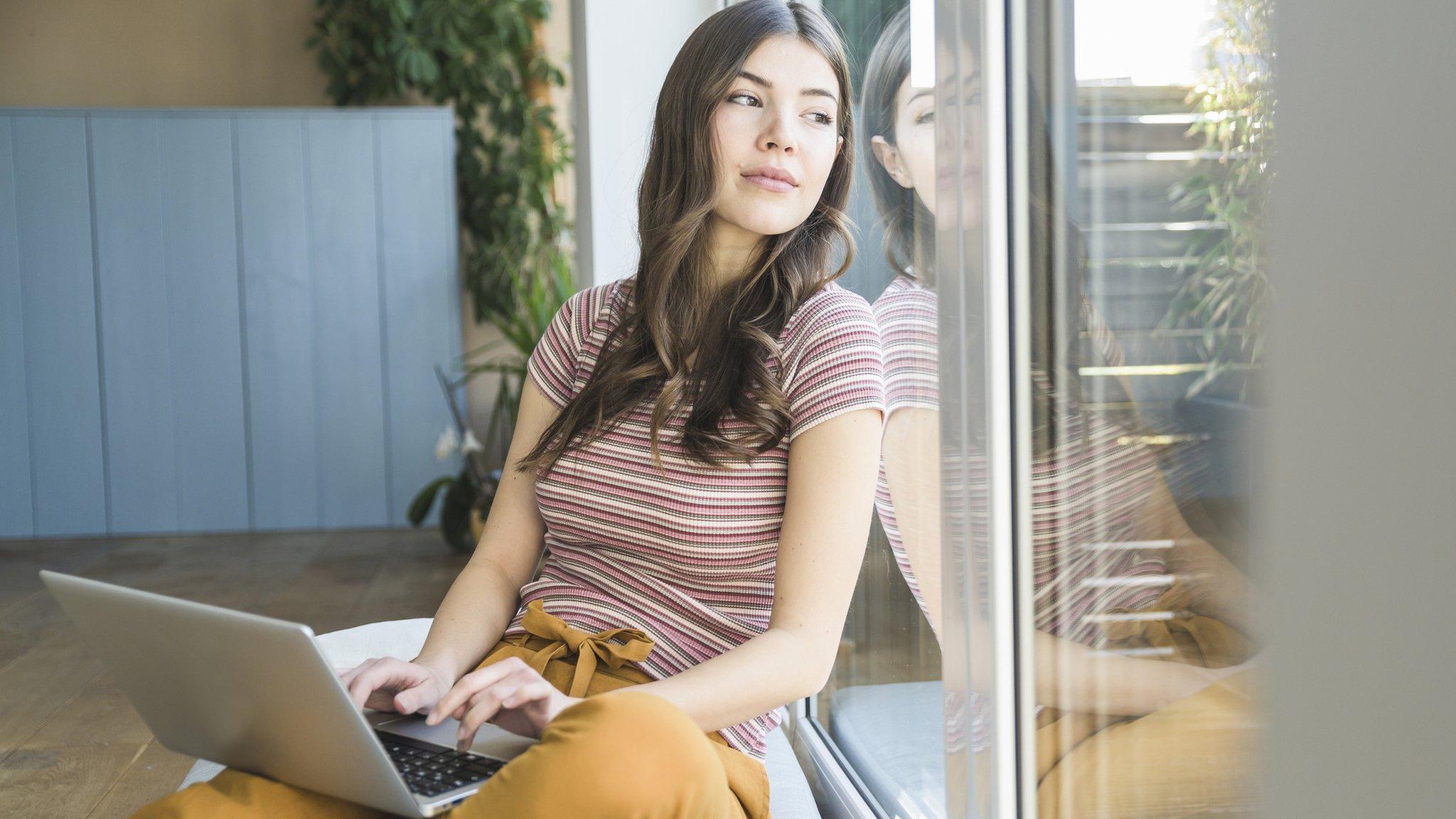 Woman staring out of window