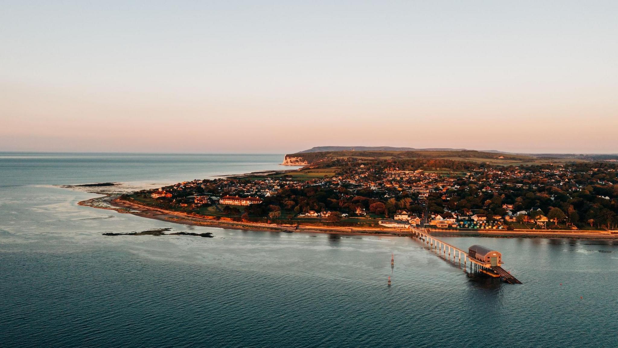 Sunrise on the Isle of Wight coast, shows an aerial view of the island