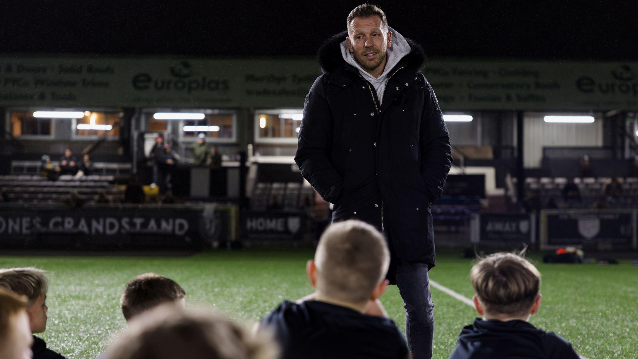 Wales head coach Craig Bellamy speaks to young players at the Merthyr Town academy