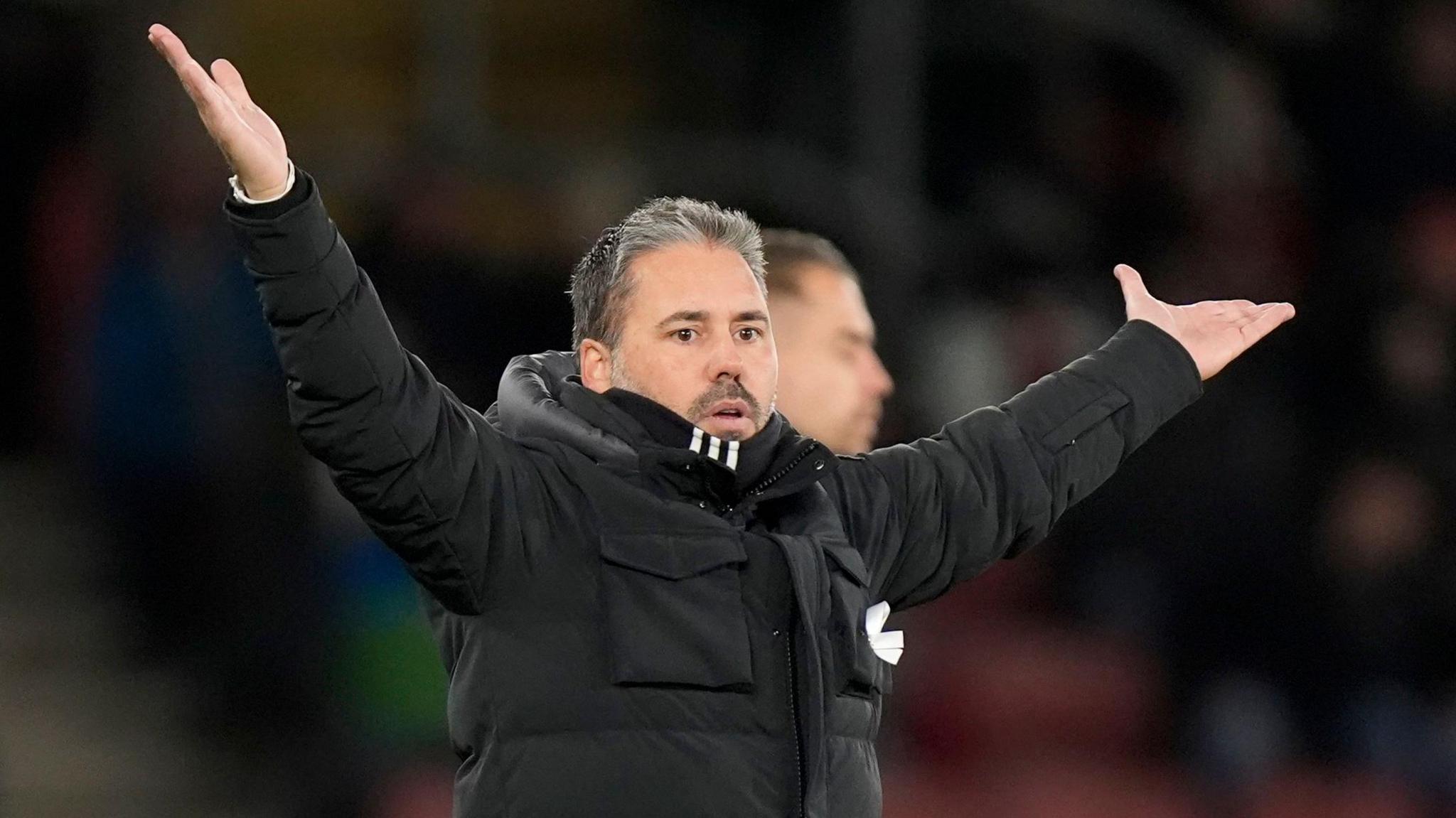 Leicester City boss Marti Cifuentes with his arms in the air