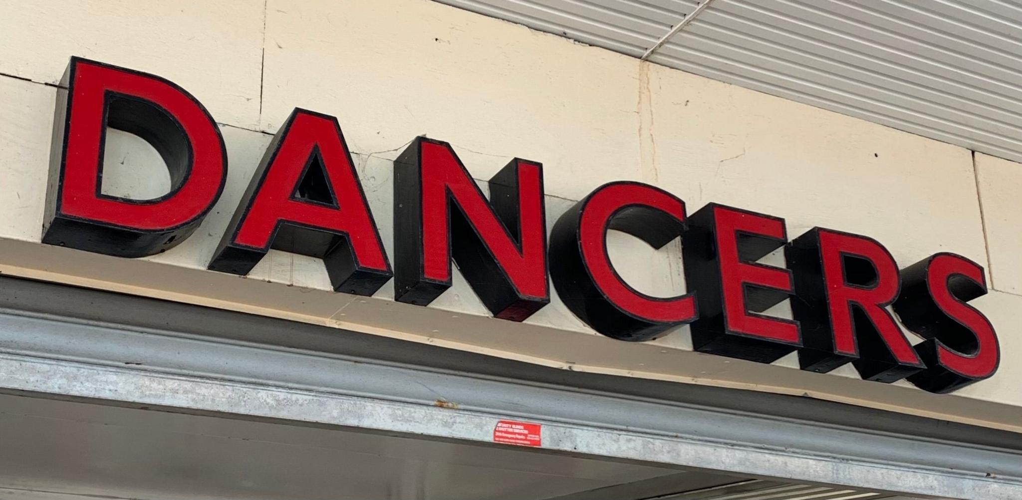 The signage for Dancers, a shop in Halesowen which recently closed. The sign is in large red letters on a white background.