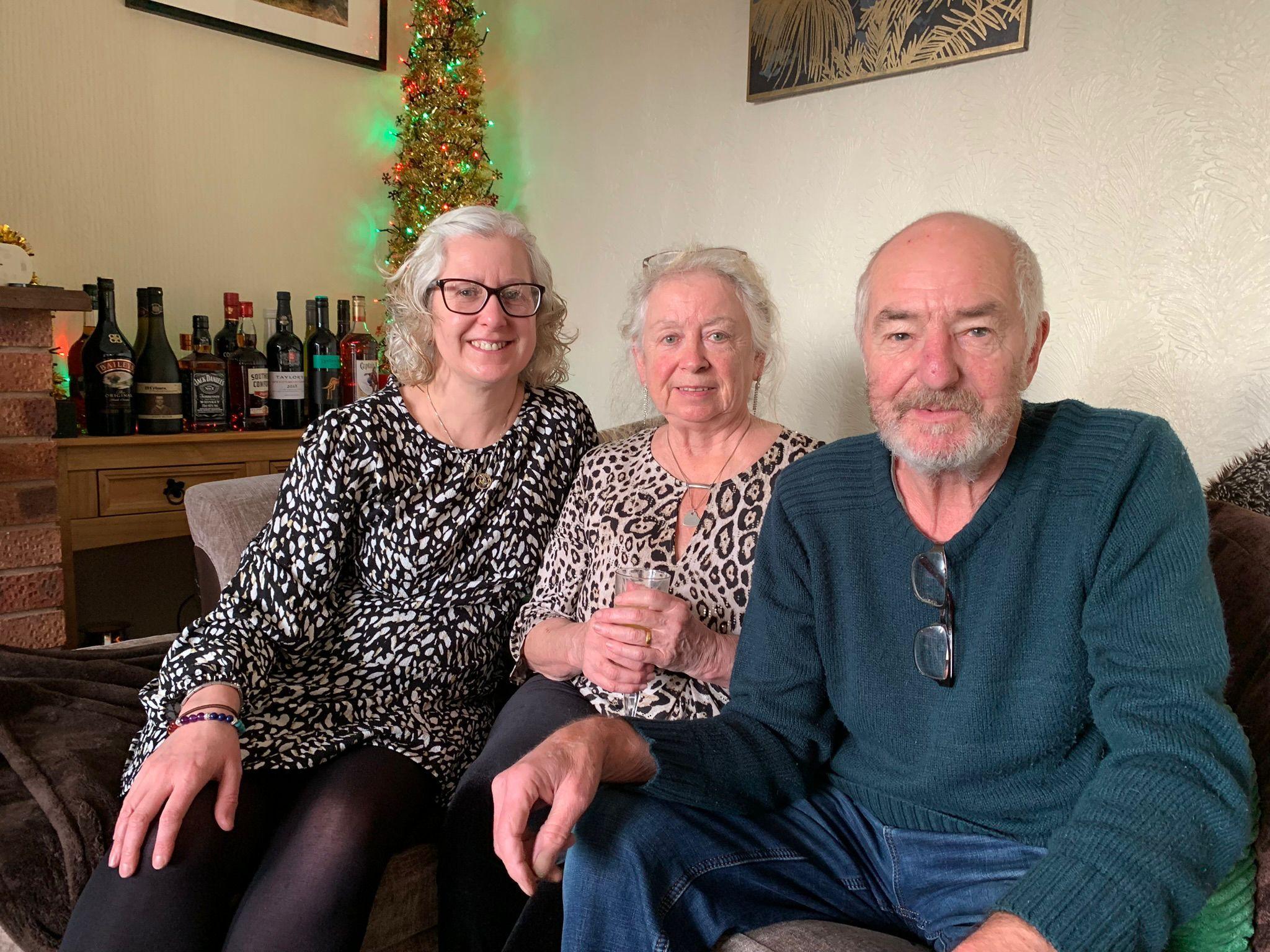 A daughter and her parents at a family Christmas