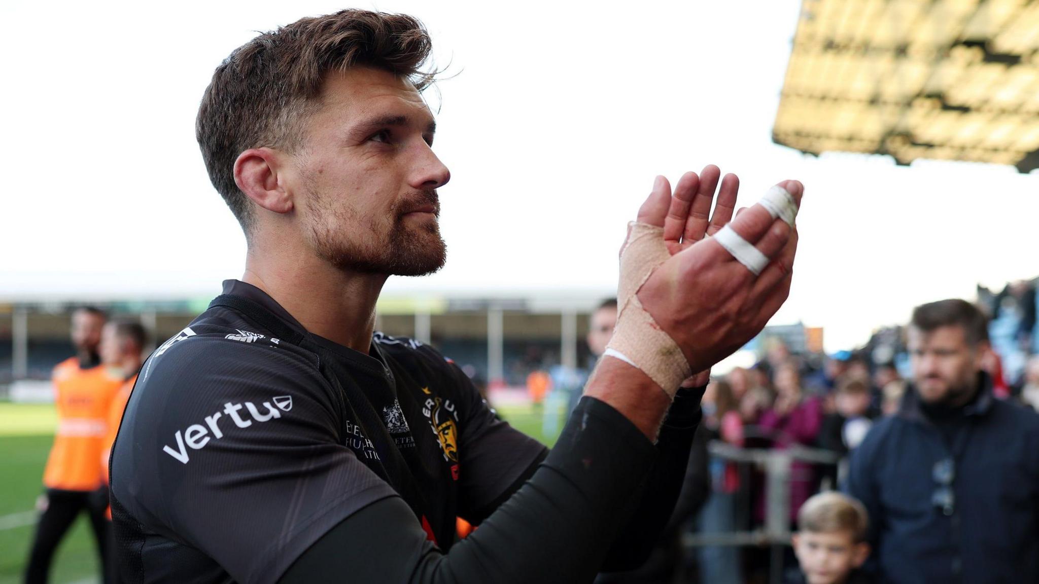 Henry Slade applauds the Exeter supporters