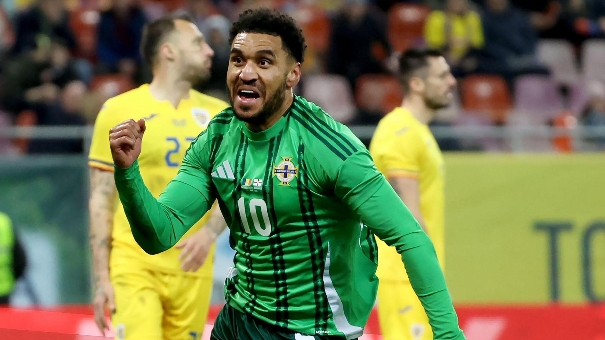 Northern Ireland and Stevenage striker Jamie Reid celebrates a goal