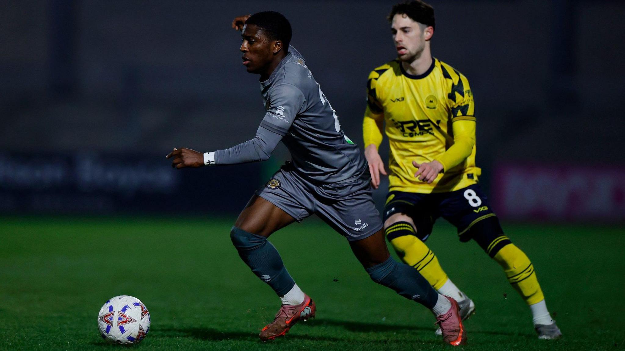 Hakeem Sandah, in all grey, playing for Farnborough against Torquay United
