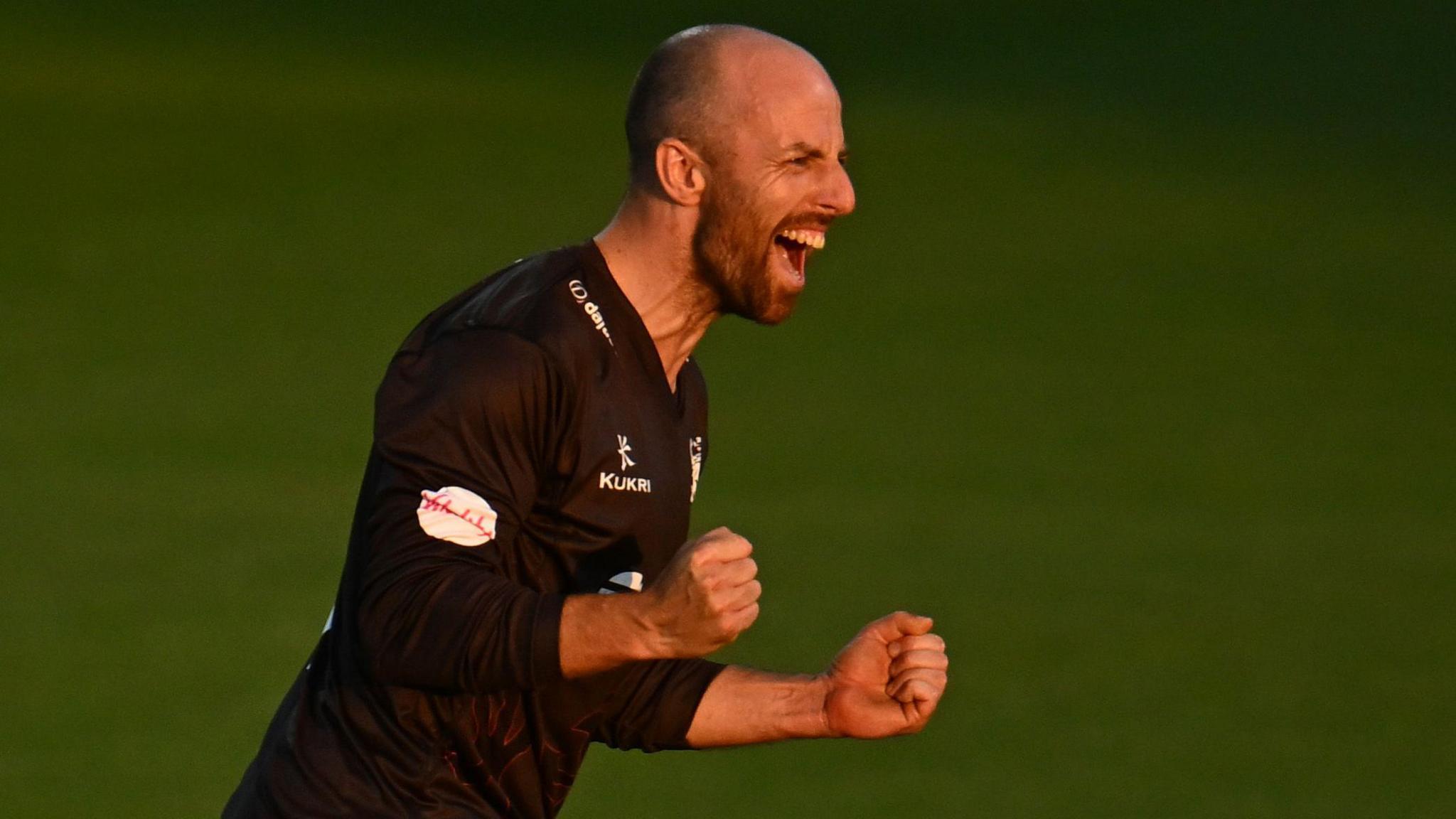 Jack Leach, wearing Somerset's black T20 shirt, celebrates taking a wicket against Worcestershire