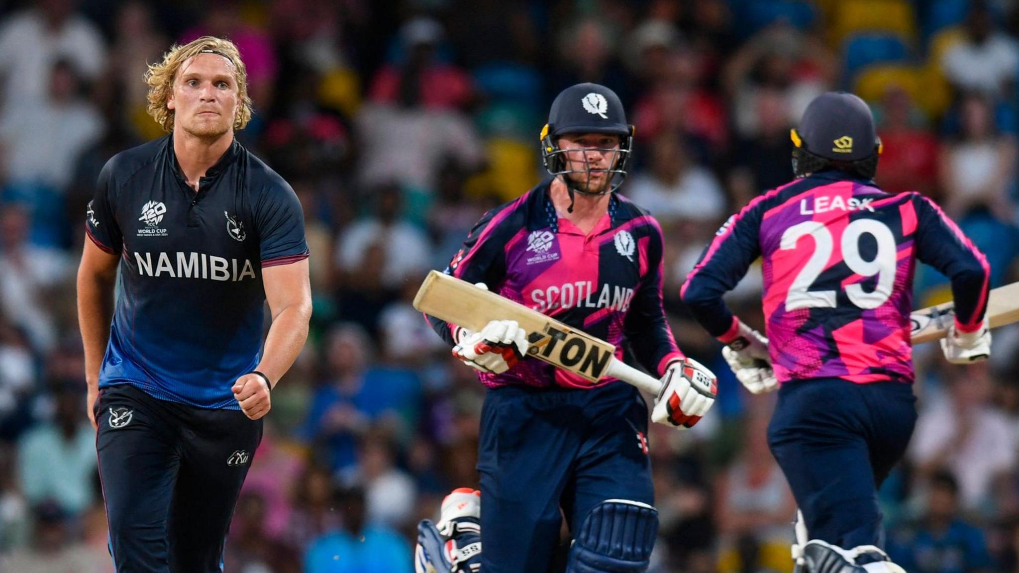 Namibia's Ruben Trumpelmann looks on as Scotland's Richie Berrington and Michael Leask run during a match in 2024