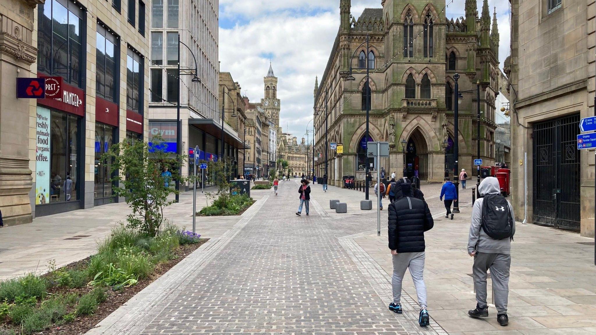The view down a main, pedestrianised street in Bradford city centre.