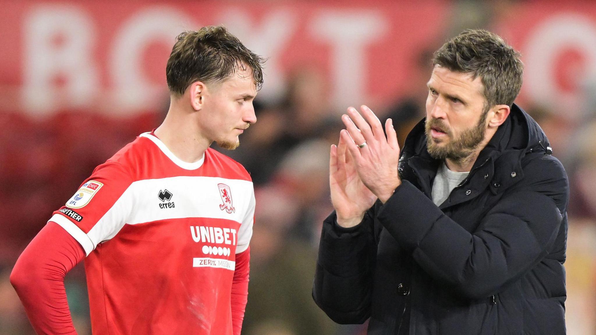 Rav van den Berg (left) looks down while Michael Carrick claps the fans after the Leeds defeat