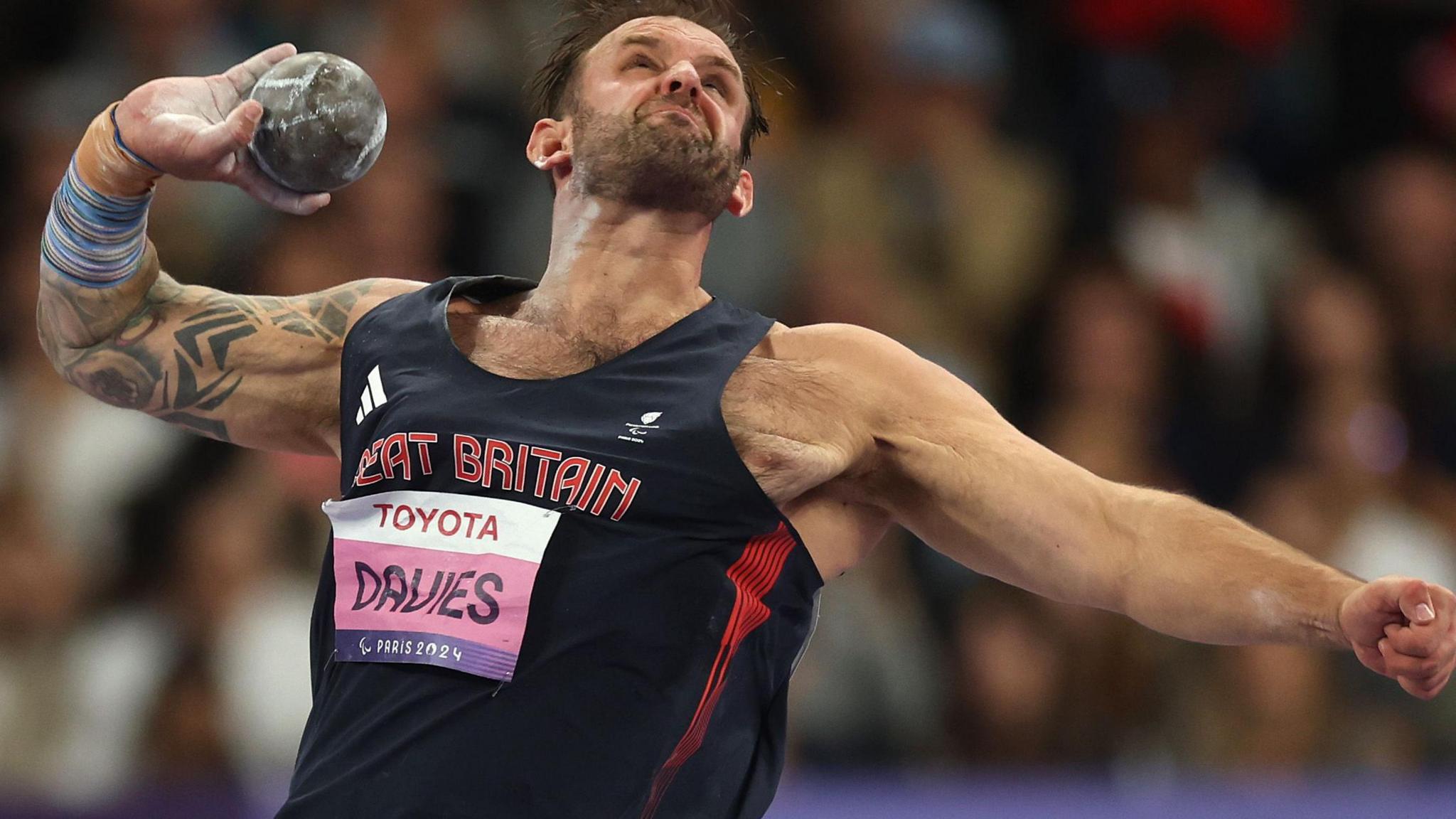 Aled Sion Davies throws the shot put in Paris