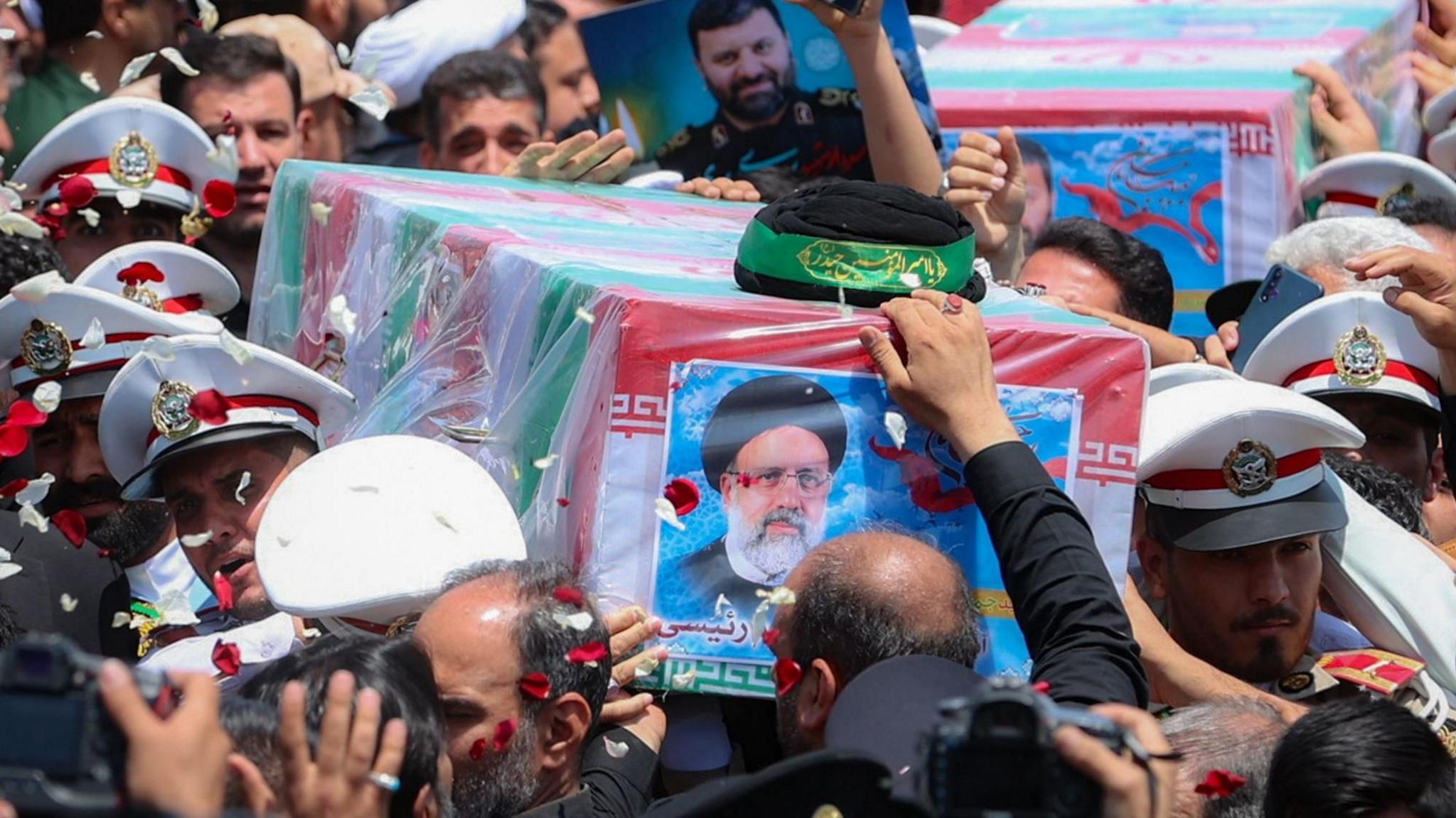 Iranian president handout photo showing security forces carrying the coffin of late president Ebrahim Raisi ahead of his burial in Mashhad, Iran (23 May 2024)