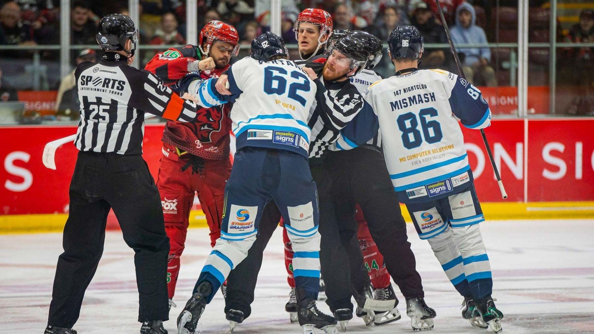 Cardiff Devils and Coventry Blaze players are separated by match officials