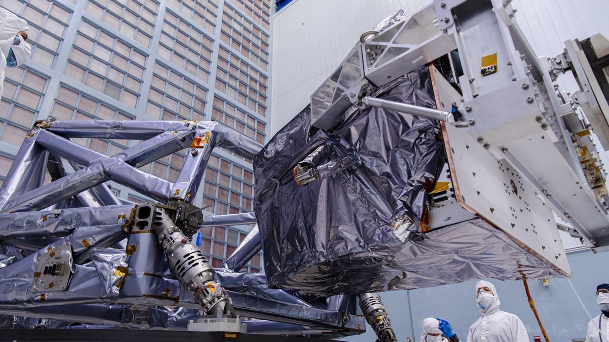 nasa engineers installing the Coronograph Instrument