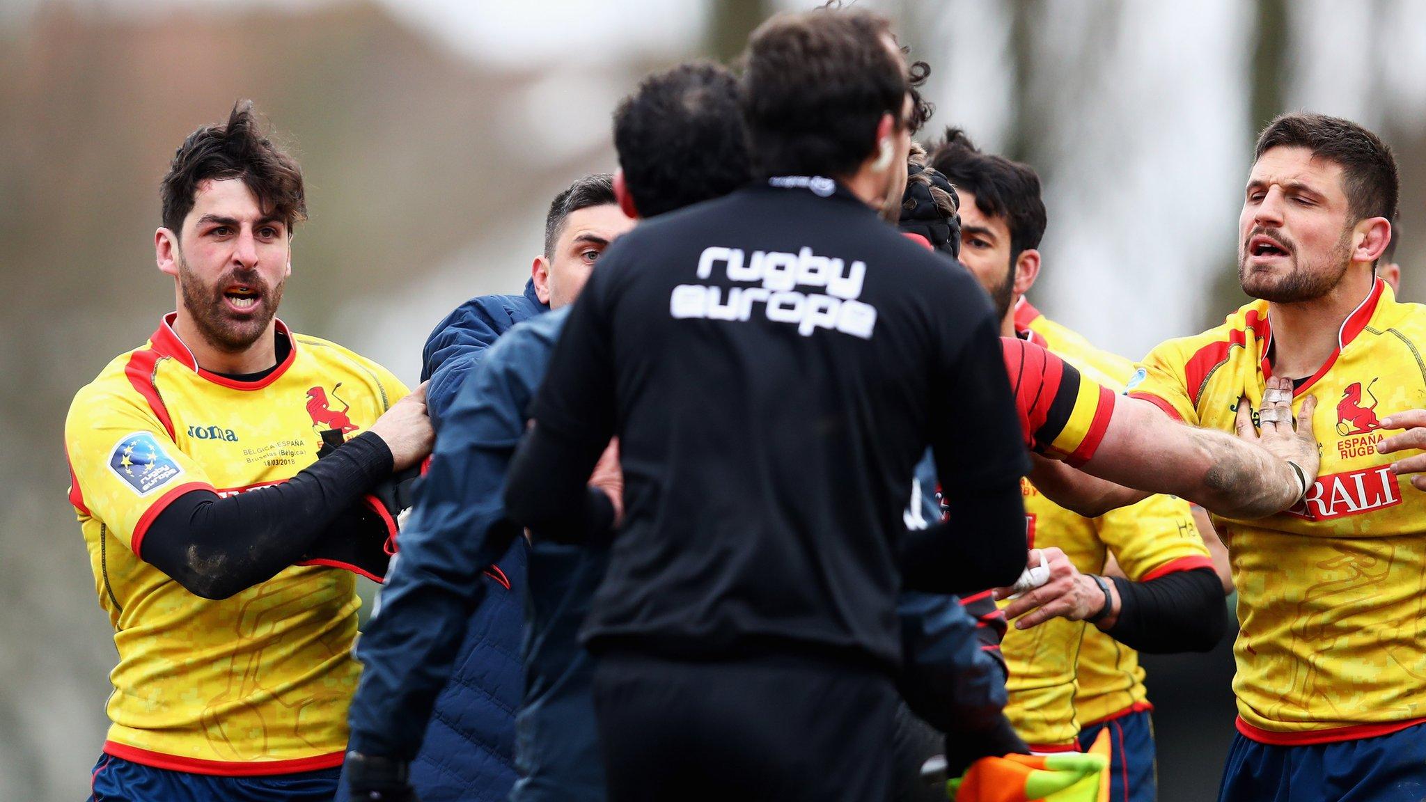 Spain players protest with referee