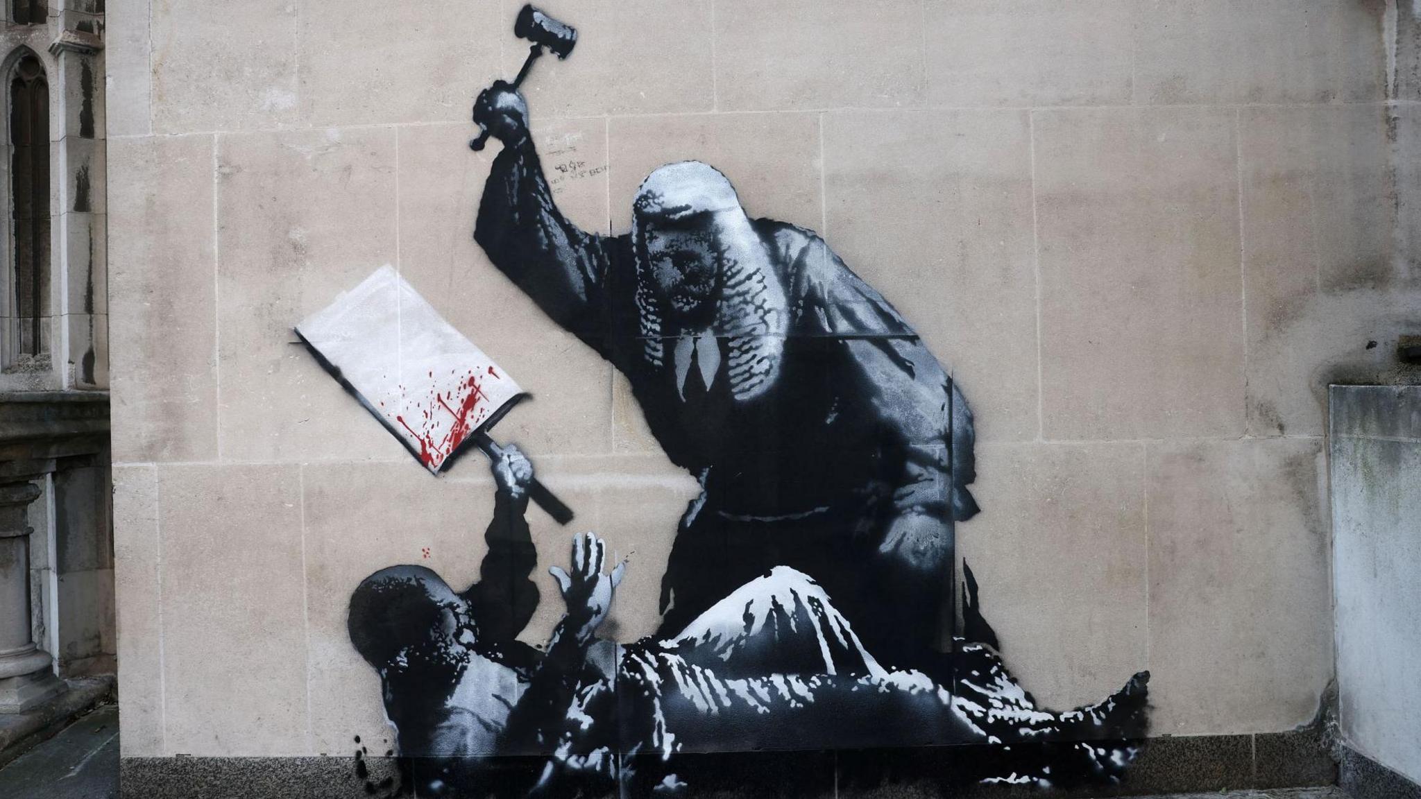 Mural of a judge attacking an apparent protestor with a gavel.