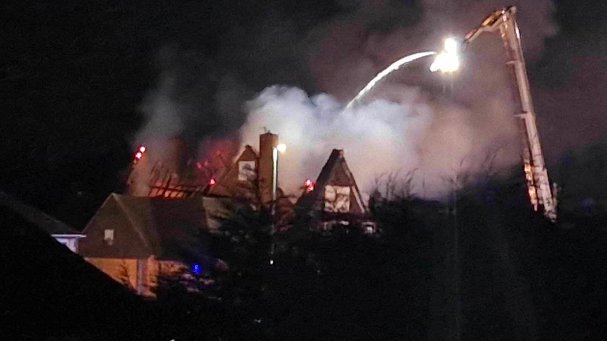 A fire service aerial ladder is pictured tackling a fire at The Bakersfield pub in Nottingham