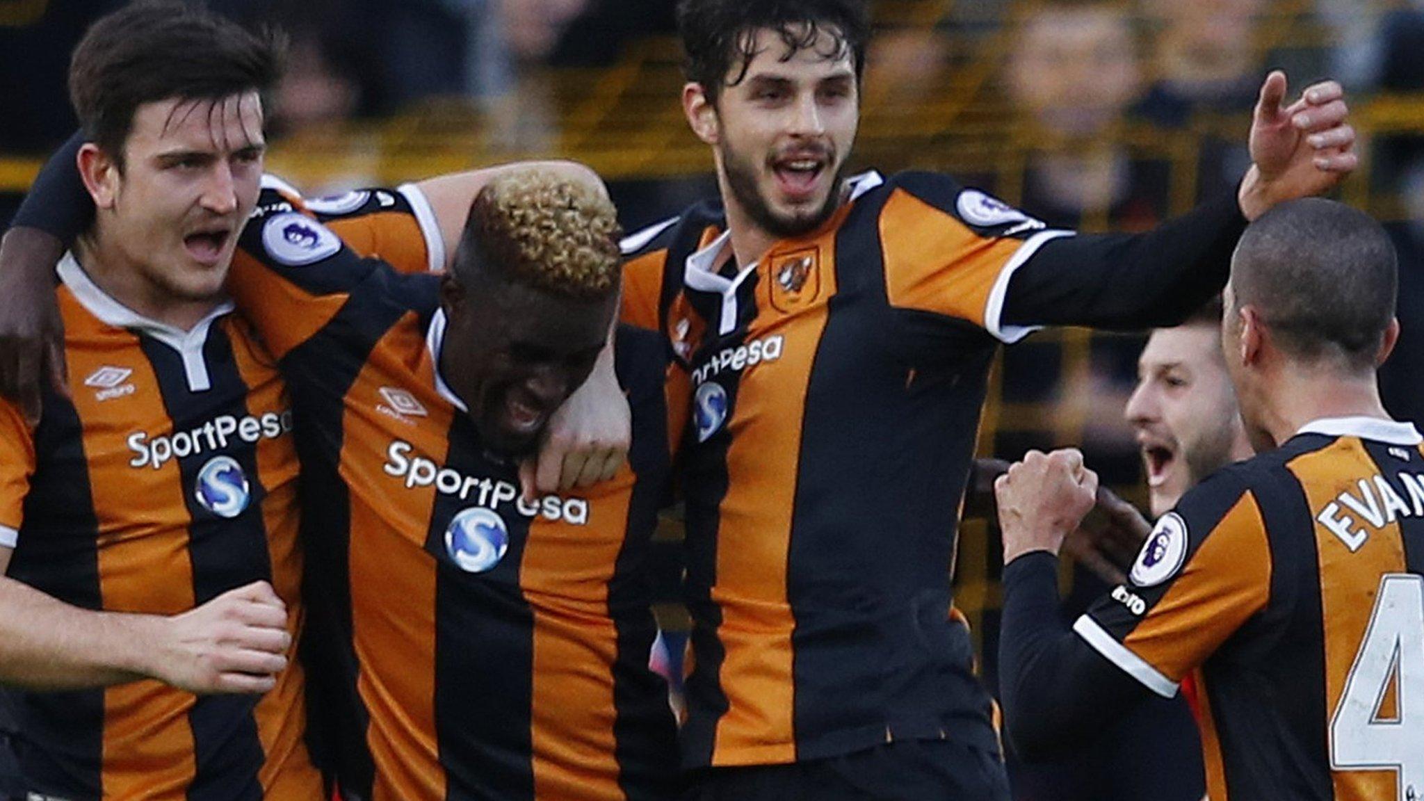 Hull City's players celebrate after taking the lead against Liverpool