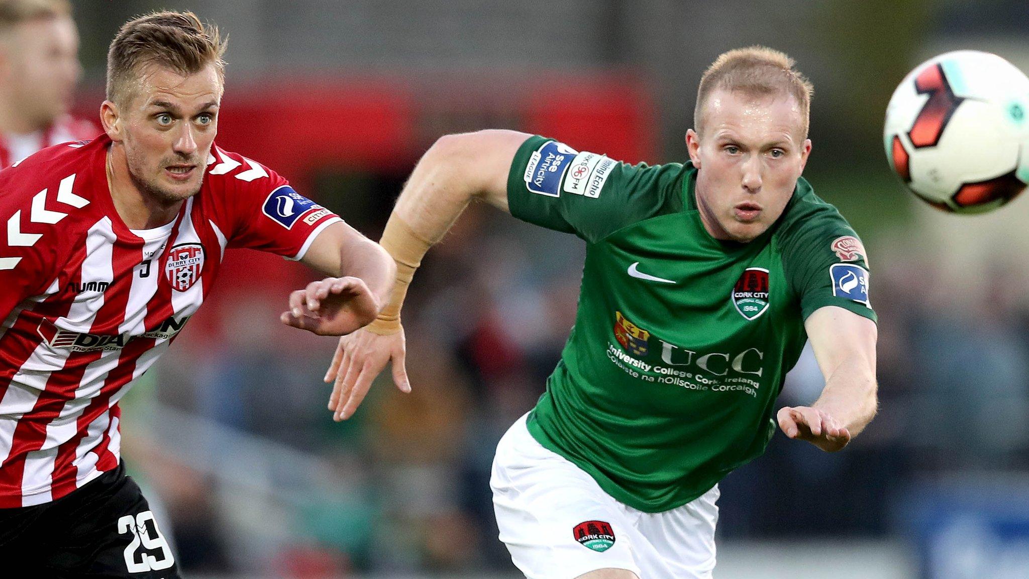 Derry's Lucas Schubert gives chase to Cork opponent Stephen Dooley