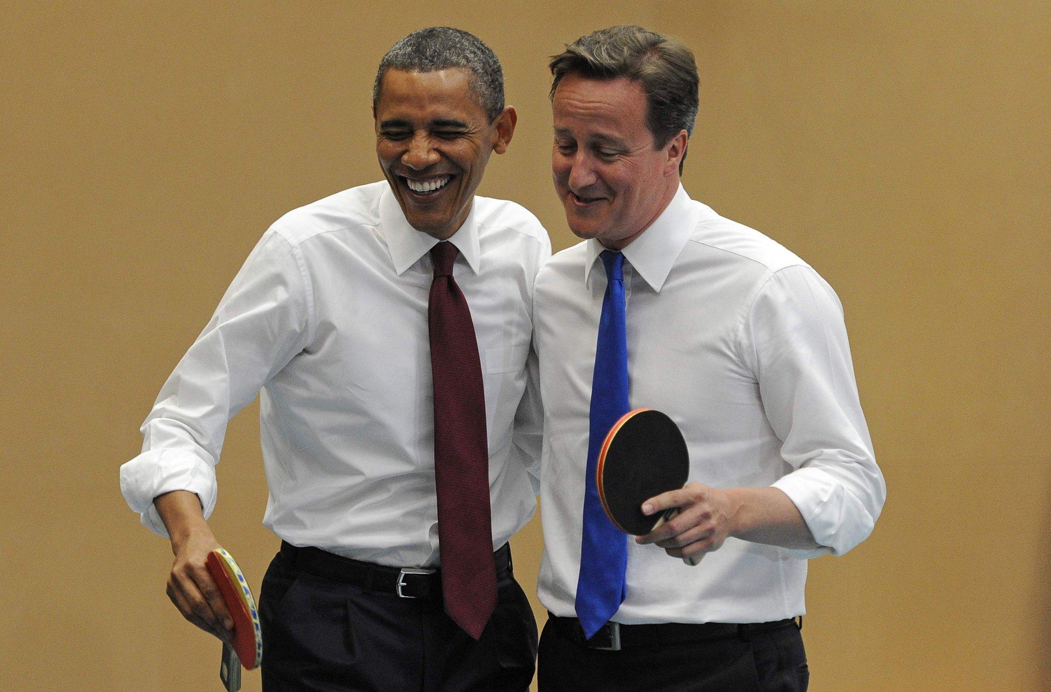 Barack Obama and David Cameron play table tennis in 2011