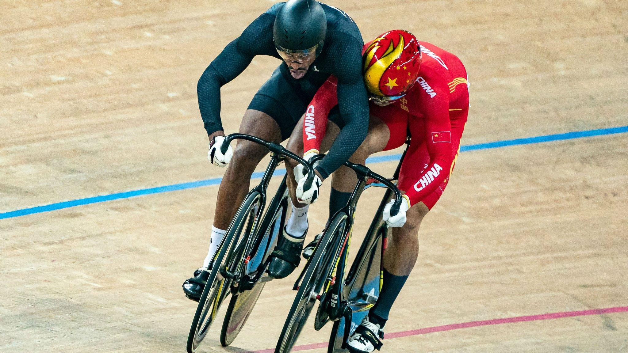 Hong Kong, 27 January: Njisane Phillip, left, of Trinidad and Tobago, and Chao Xu, of China, get a little too close for comfort in the quarter-finals of the men's sprint on day four of the UCI Track Cycling World Cup at the Hong Kong Velodrome. (Photo by Anthony Kwan/Getty Images)