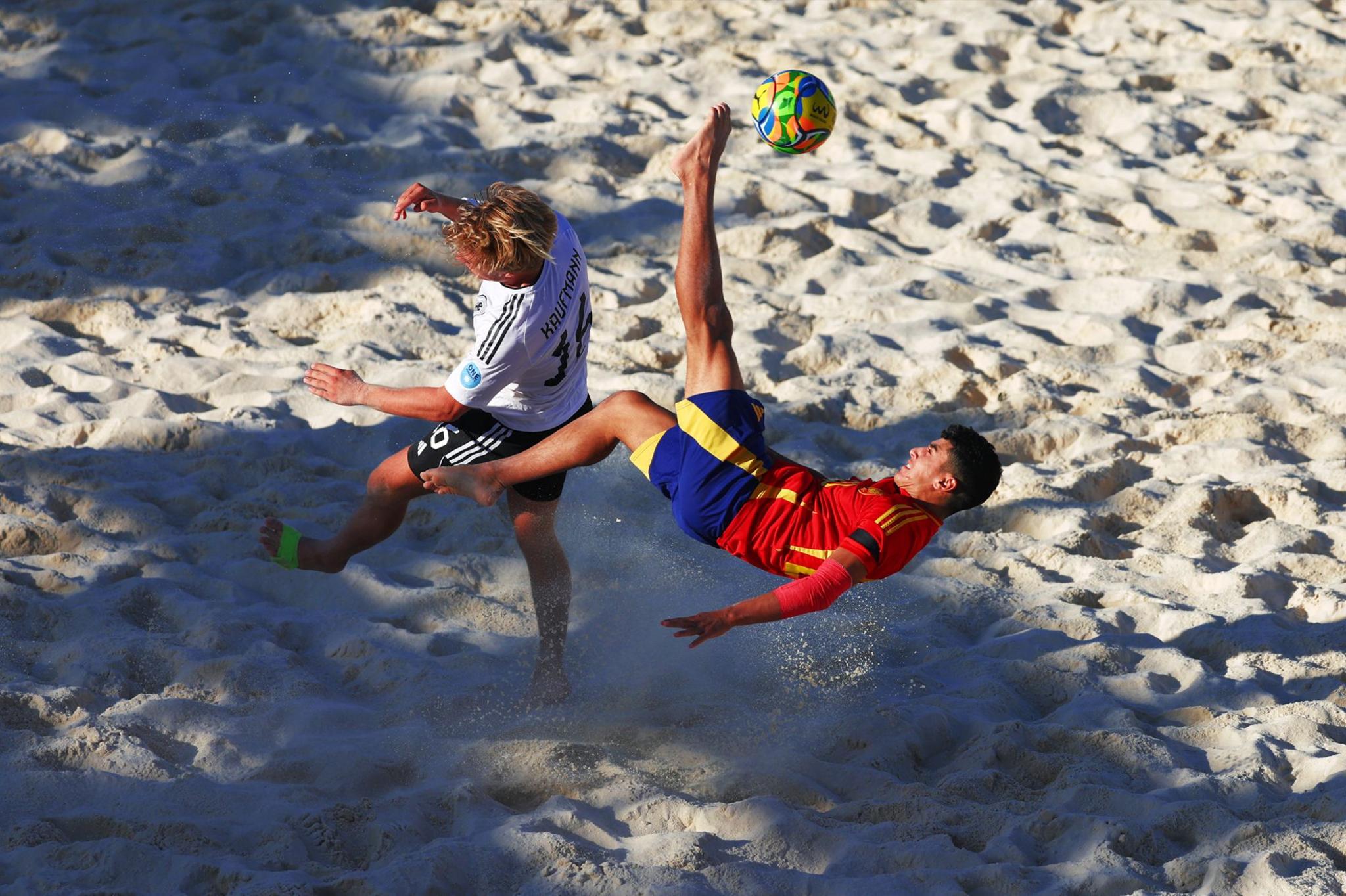 Ramy Saghadani El Ouariachi of Spain performs an overhead kick whilst under pressure from Tim Nicolas Kaufmann of Germany in the third-place match at the Neom Beach Games on 16 November 2024 in Neom, Saudi Arabia.