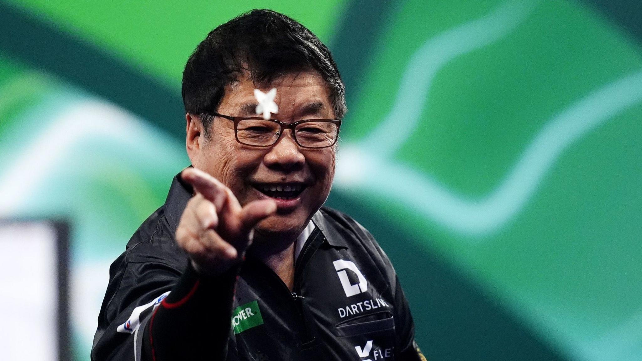 Paul Lim celebrates a win at the PDC World Championship