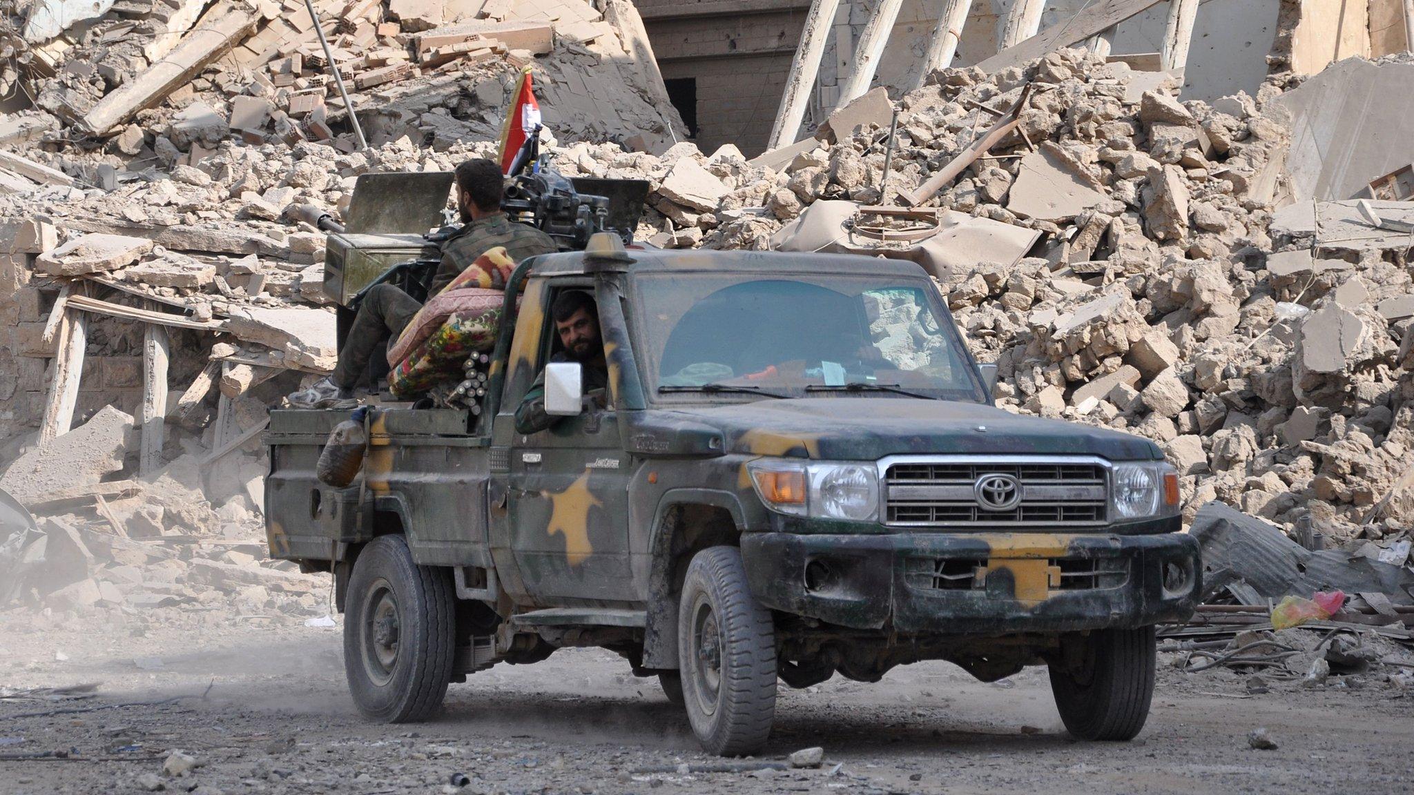 Syrian pro-government forces patrol the eastern city of Deir al-Zour on 4 November 2017