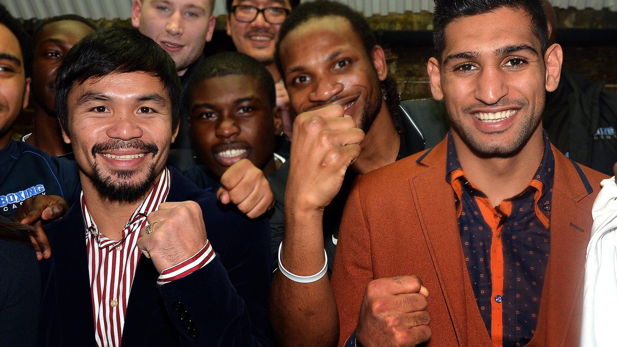 Manny Pacquiao (left) with Amir Khan last month