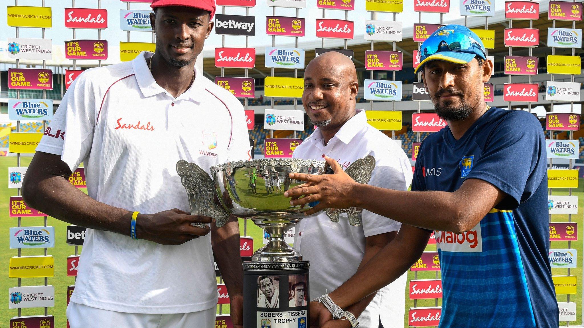 West Indies captain Jason Holder and Sri Lanka stand-in skipper Suranga Lakmal with the Sobers-Tissera Trophy