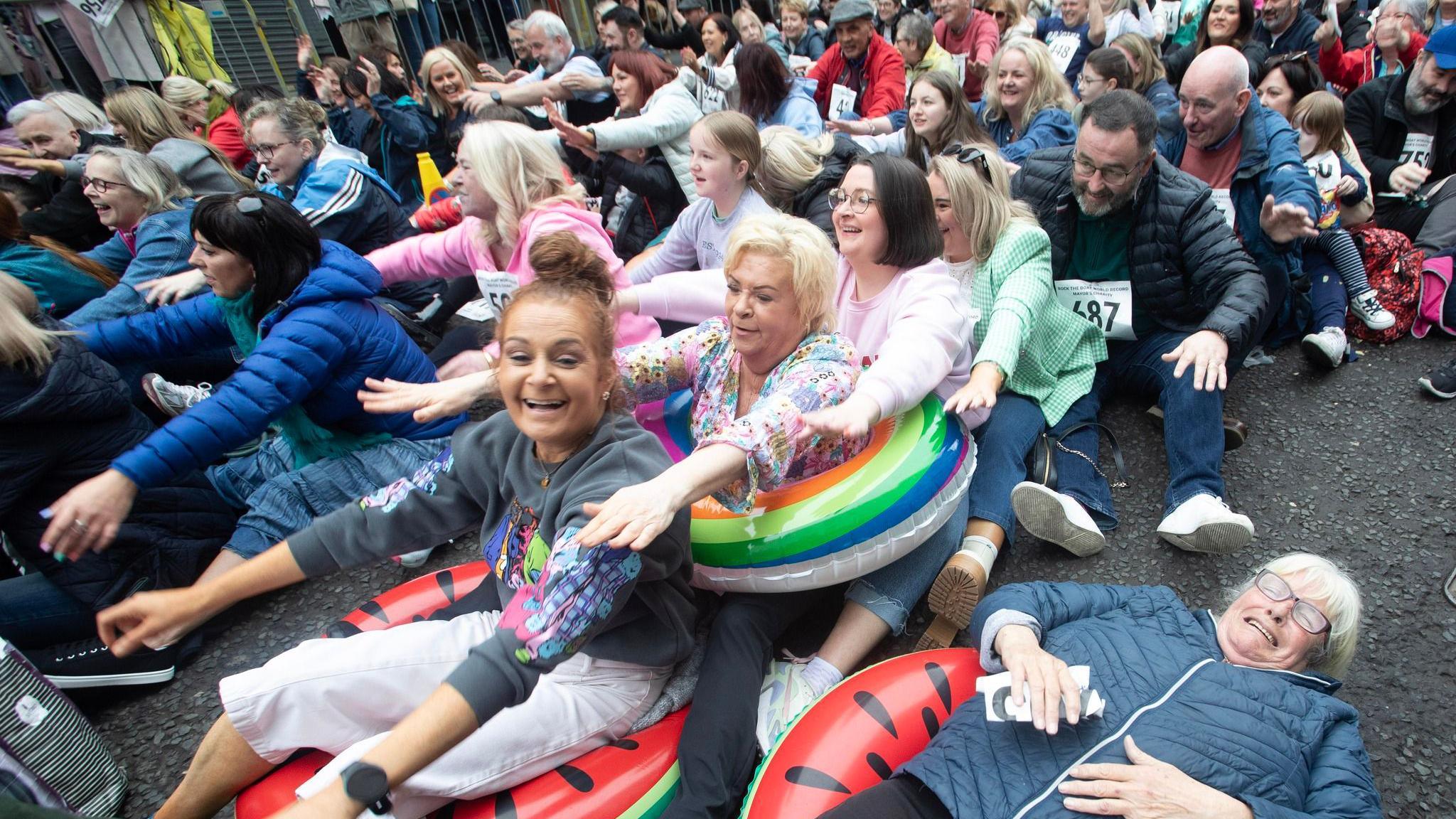 people taking part in world record rock the boat attempt in derry