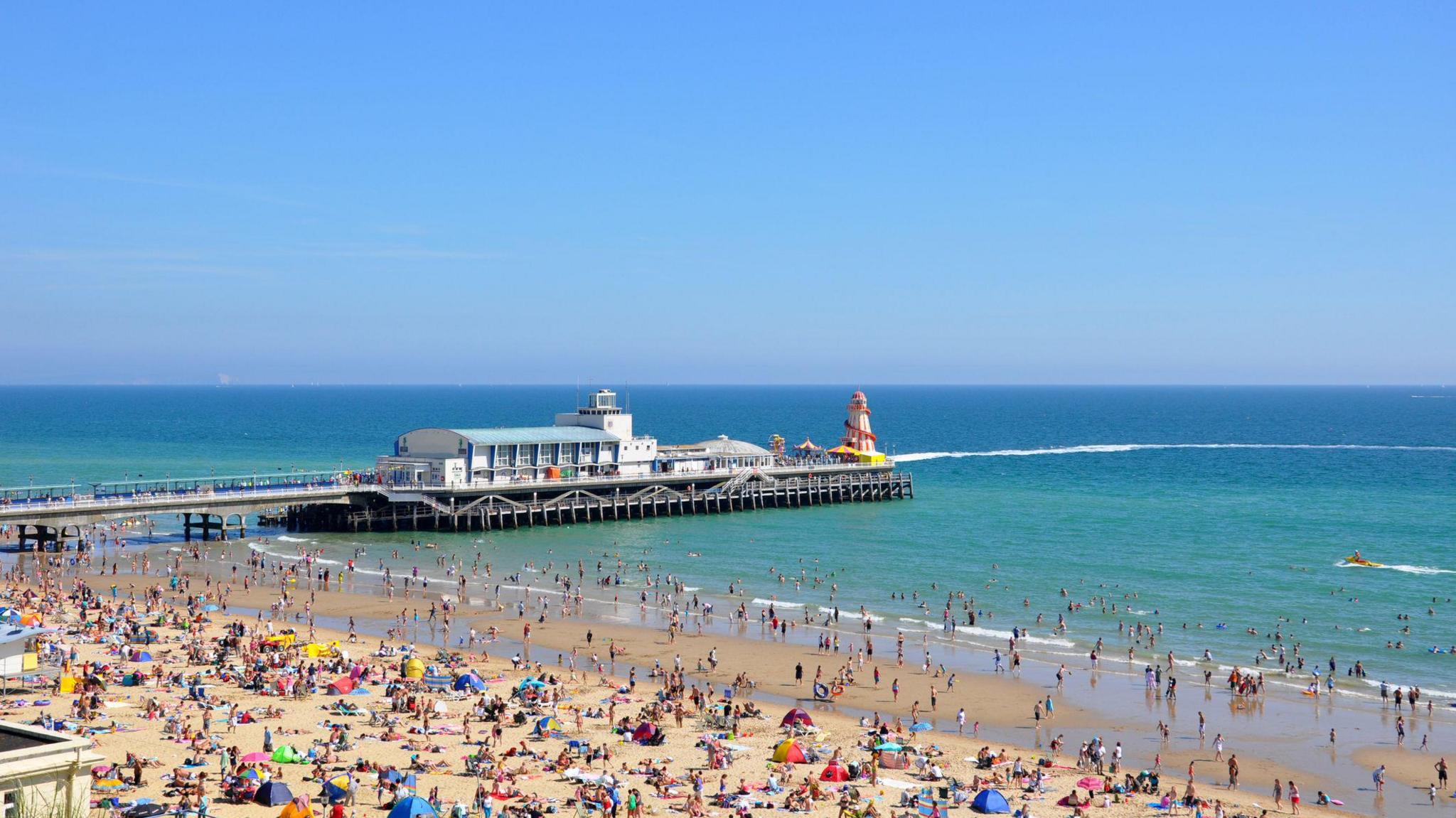 An aerial view of Bournemouth Pier on a clear summer's day.