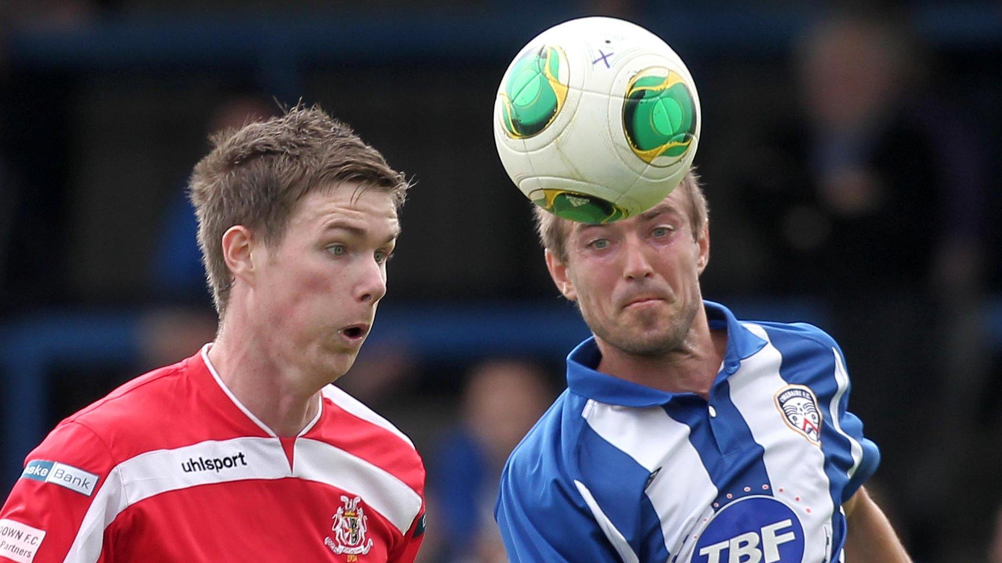 Former Portadown player Peter McMahon and Coleraine's Steven Douglas battle in 2013