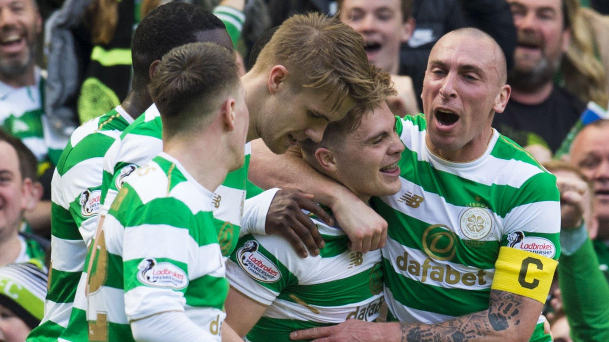 Celtic players celebrate against Rangers