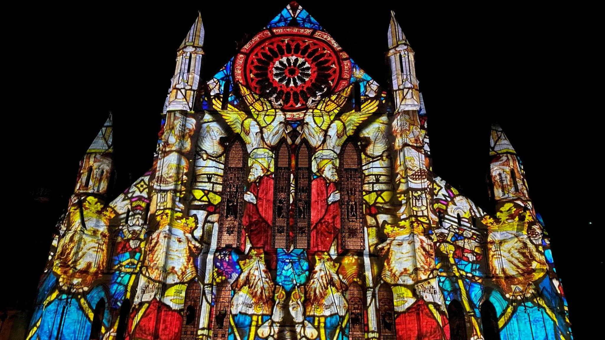 An image of ancient royals projected onto the façade of York Minster