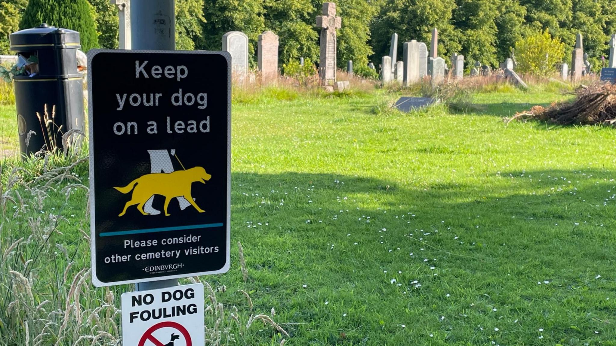 Keep your dog on a lead sign in a cemetery