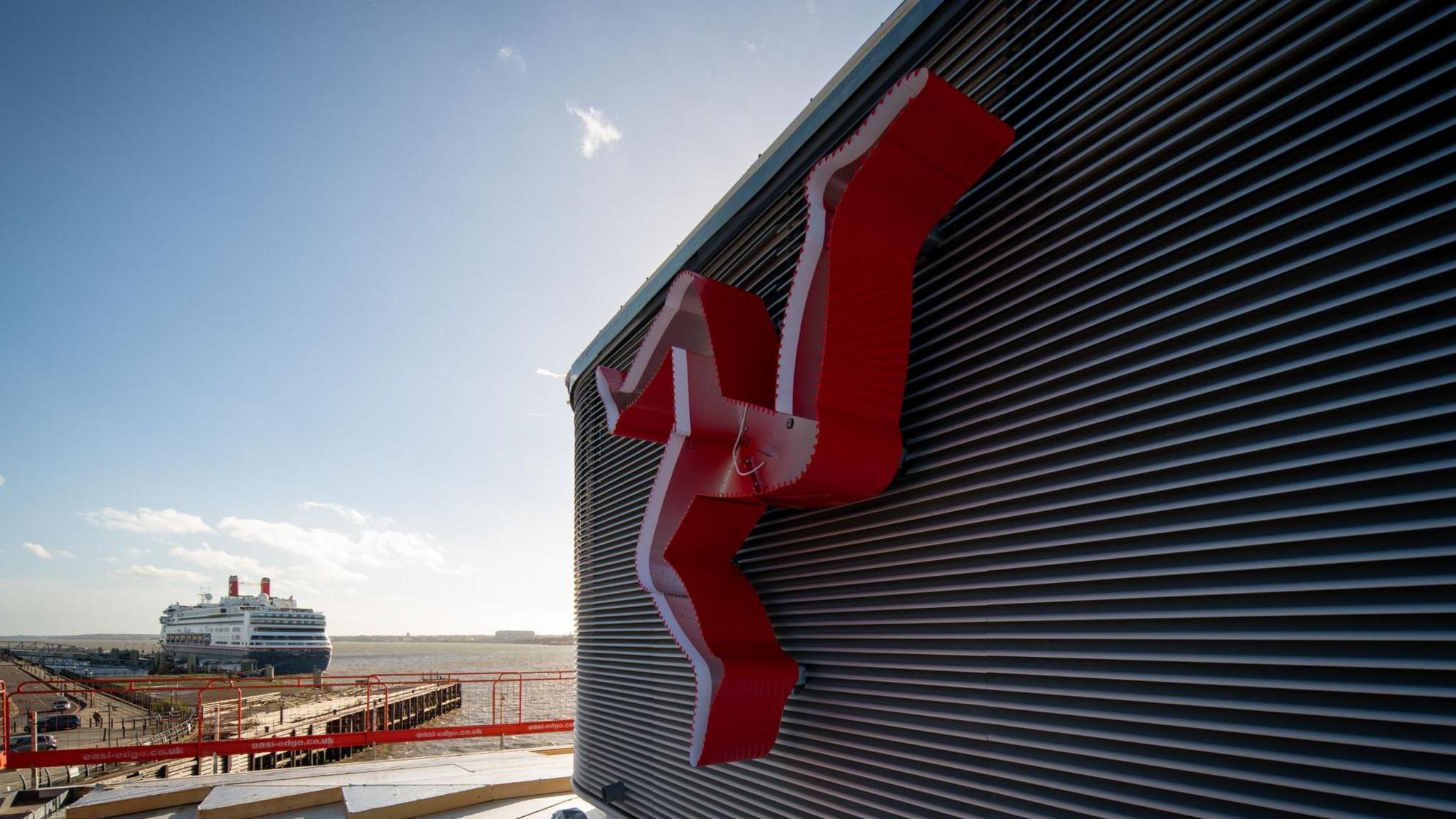 The three legs of man symbol on the ferry terminal under construction in Liverpool