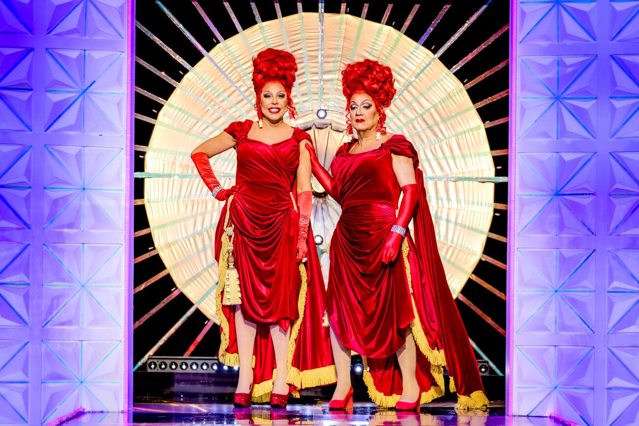 La Voix is stood next to her father on RuPaul's Drag Race, both dressed as the same drag queen- wearing the same wig, makeup and dress.