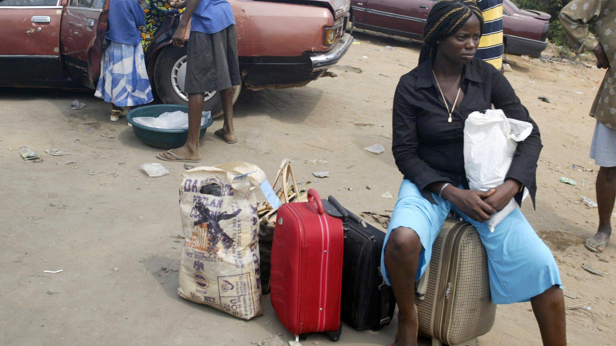 Woman waiting for petrol