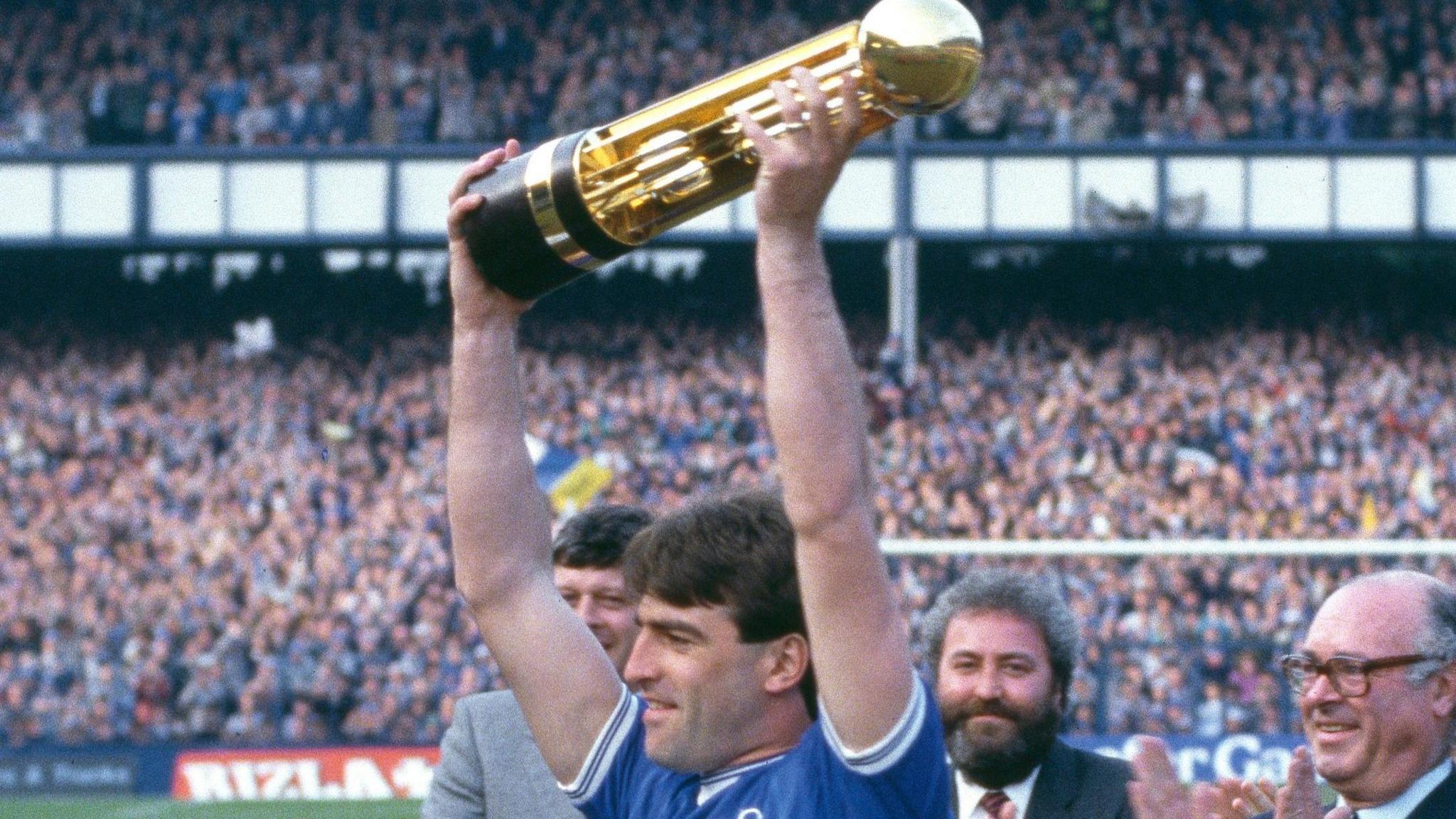 Kevin Ratcliffe lifts the Canon League First Division trophy in May 1985