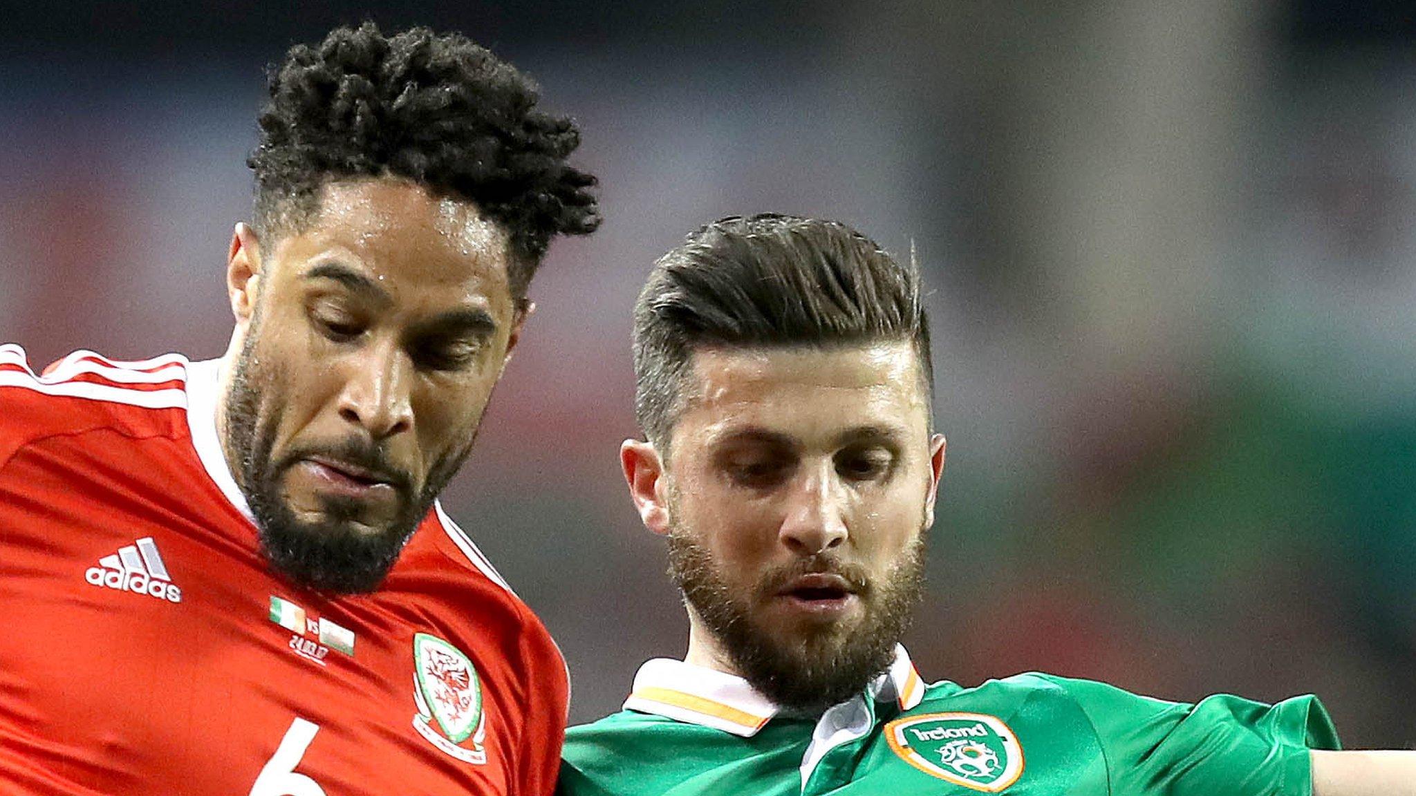 Wales captain Ashley Williams takes on Republic of Ireland's Shane Long in March, 2017