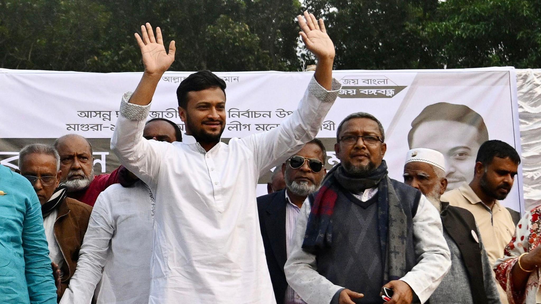 Bangladeshi cricketer-turned-politician Shakib Al Hasan waving to supporters during a campaign rally in Magura in December 2023.