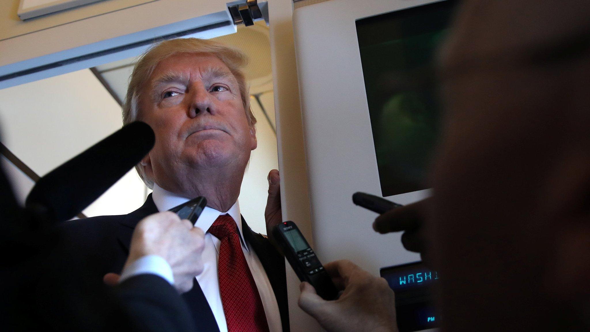 .S. President Donald Trump talks to journalists, members of the travel pool, on board of Air Force One during his trip to Palm Beach, Florida, U.S., April 6, 2017