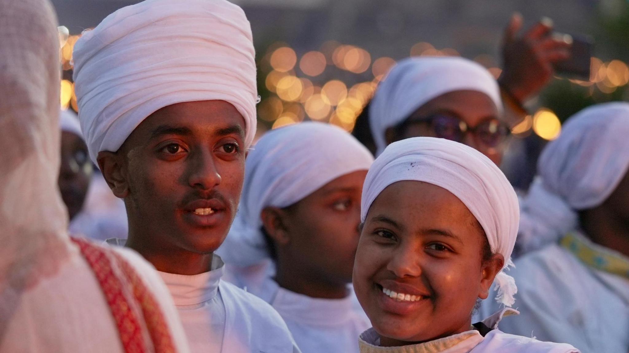 Youngsters dressed in white pose for a picture during the 2024 Meskel celebrations in Addis Ababa.