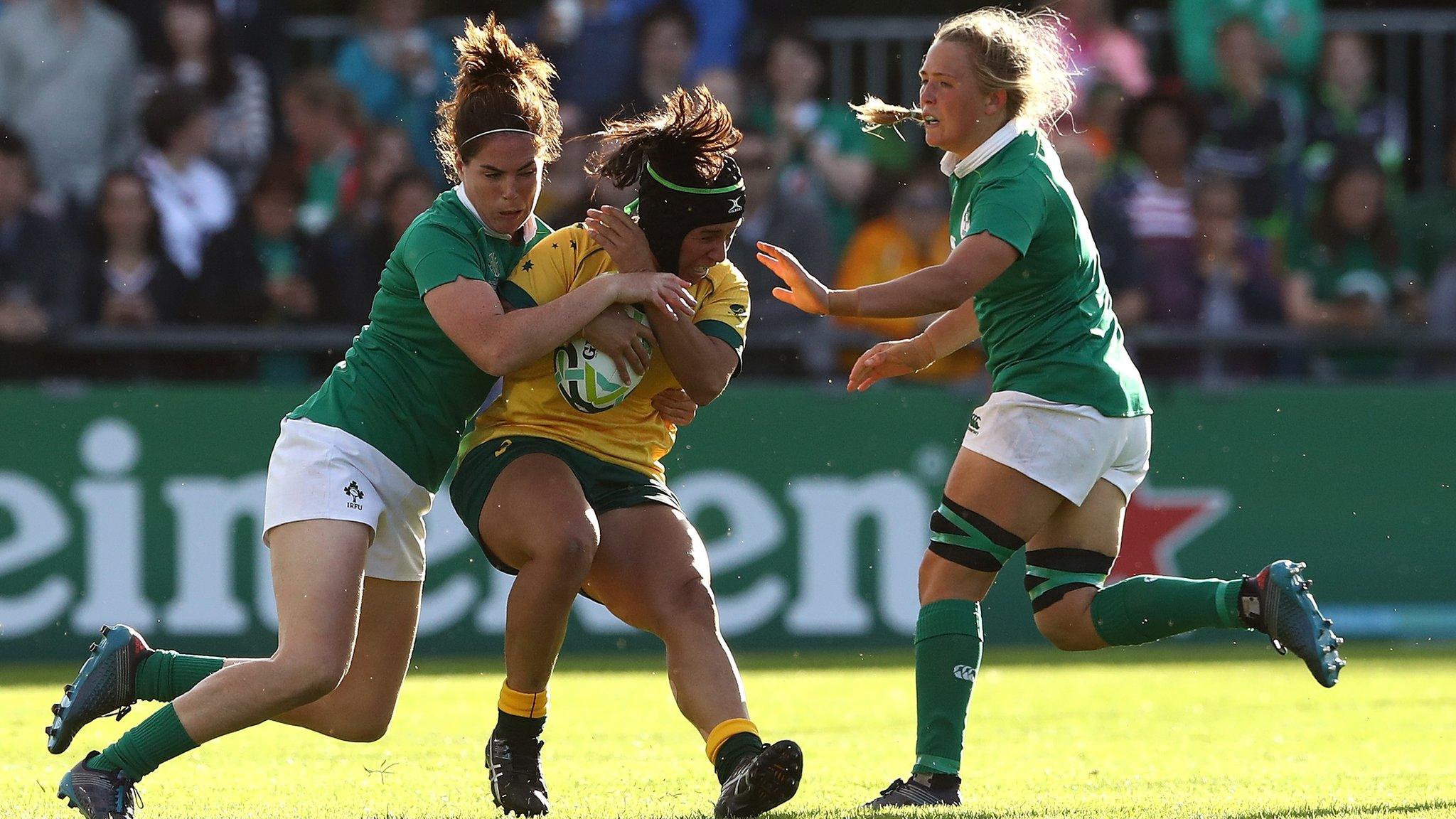 Cheyenne Campbell of Australia is tackled by Nora Stapleton