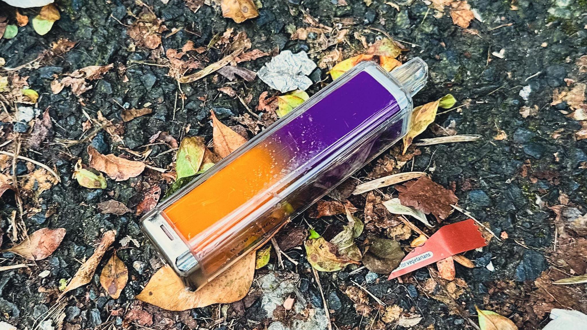 disposable vape on the ground. 